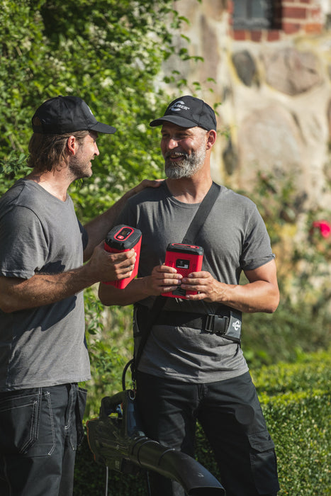 Cramer Red and Black 82V 4.0Ah Battery in use