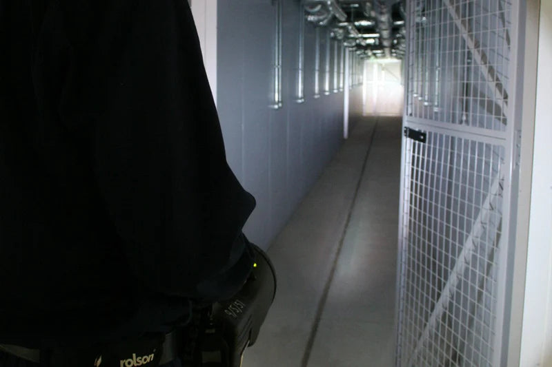 Black NightSearcher Panther XHP-X rechargeable searchlight in use